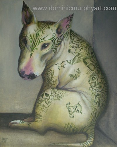 A tattooed dog looking introspective